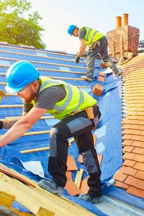 Workers repairing a roof