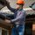 Worker measuring ceiling height.
